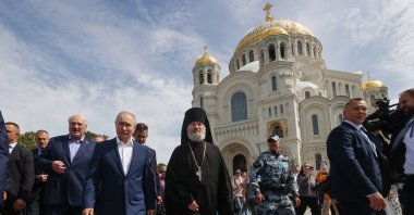 Russian President Vladimir Putin (2nd L), Belarusian President Alexander Lukashenko (3-L) and Father Superior Alexy of the Naval Cathedral of St. Nicholas in Kronstadt, St. Petersburg, Russia, July 23, 2023. (EPA Photo)