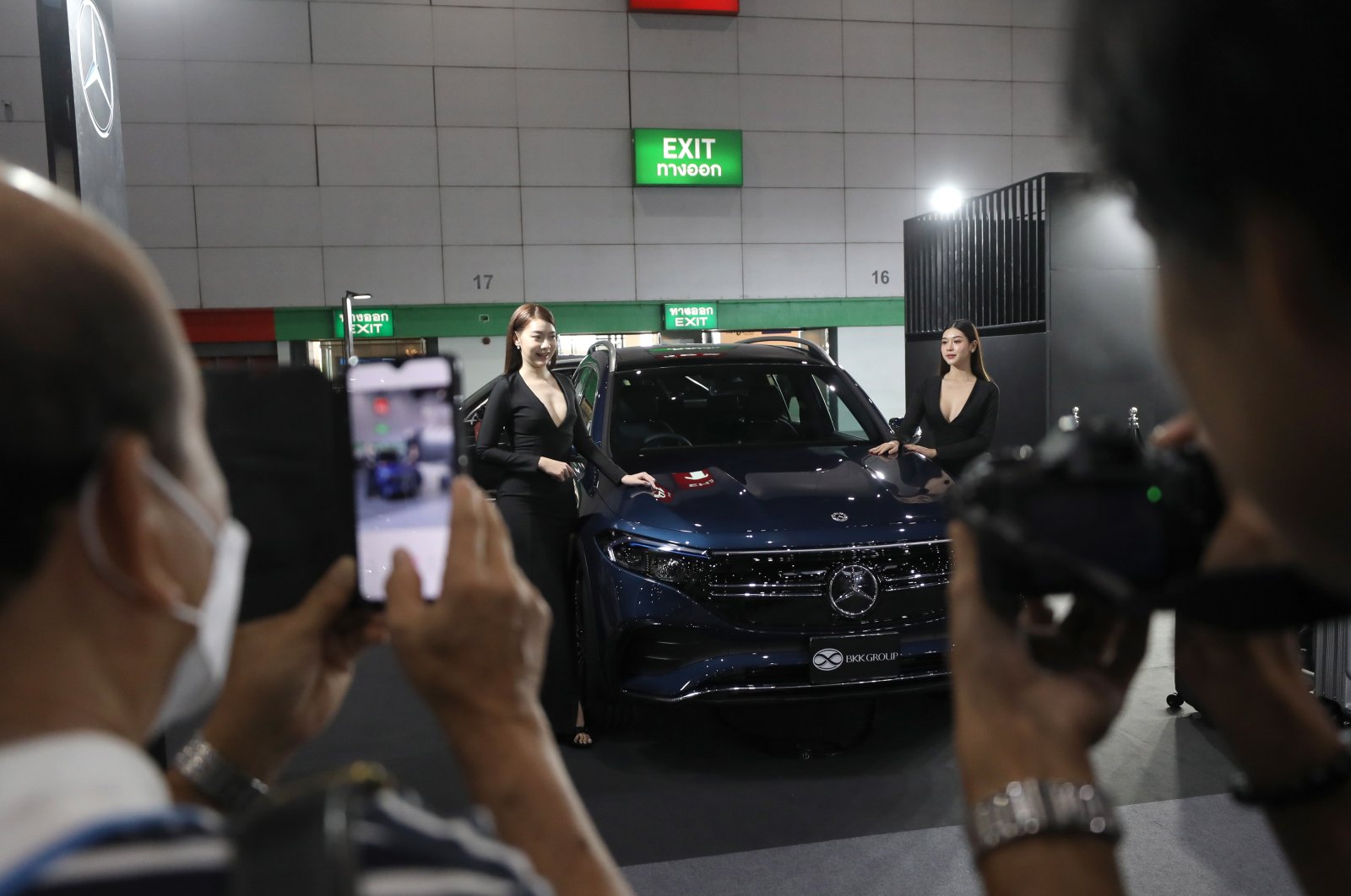 Visitors take photos of a Mercedes Benz EQB 250 electric vehicle (EV) car on display at the Fast Auto Show Thailand and EV Expo 2023 trade show at BITEC in Bangkok, Thailand, July 5, 2023. (EPA Photo)