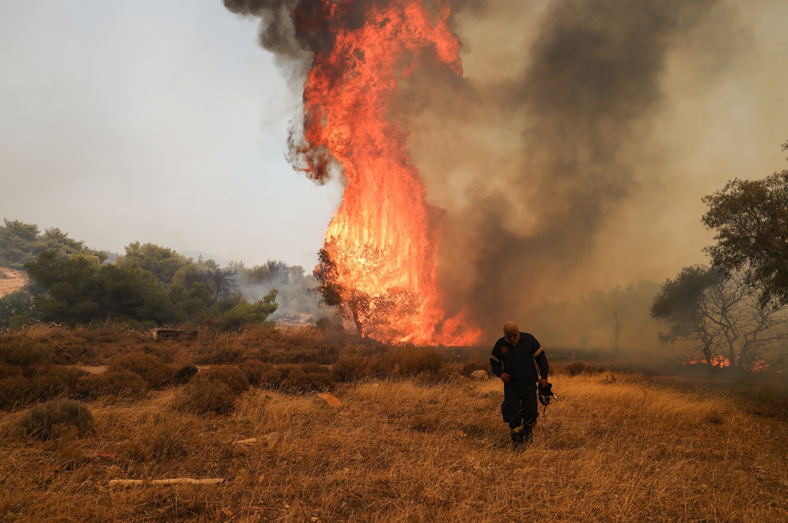 A firefighter near a raging wildfire in Vlichada near Athens, Greece, July 19, 2023. (AA Photo)