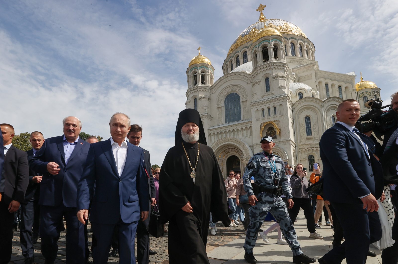 Russian President Vladimir Putin (2nd L), Belarusian President Alexander Lukashenko (3-L) and Father Superior Alexy of the Naval Cathedral of St. Nicholas in Kronstadt, St. Petersburg, Russia, July 23, 2023. (EPA Photo)
