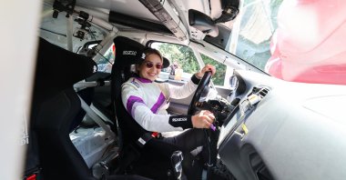 Turkish special motorsports rider Kübra Denizci poses for a photo in a car, Bursa, Türkiye, July 23, 2023. (IHA Photo)