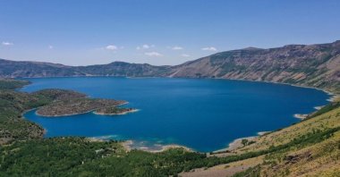 A beautiful view of Nemrut Cater Lake, the country's largest crater lake, Bitlis, Türkiye, July 24, 2023. (IHA Photo)