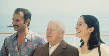 Legendary actor Charlie Chaplin celebrates his 84th birthday with his daughter Josephine Chaplin and Nicholas Sistouaris. (Getty Images Photo)