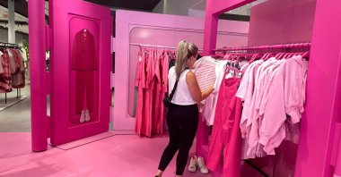 A shopper browses Barbie-themed merchandise at the Barbie pop-up in Zara&#039;s Soho store in New York City, U.S., July 20, 2023. (Reuters Photo)