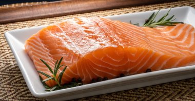 Freshly sliced Norwegian Salmon fish fillet, July 25, 2023. (Shutterstock Photo)