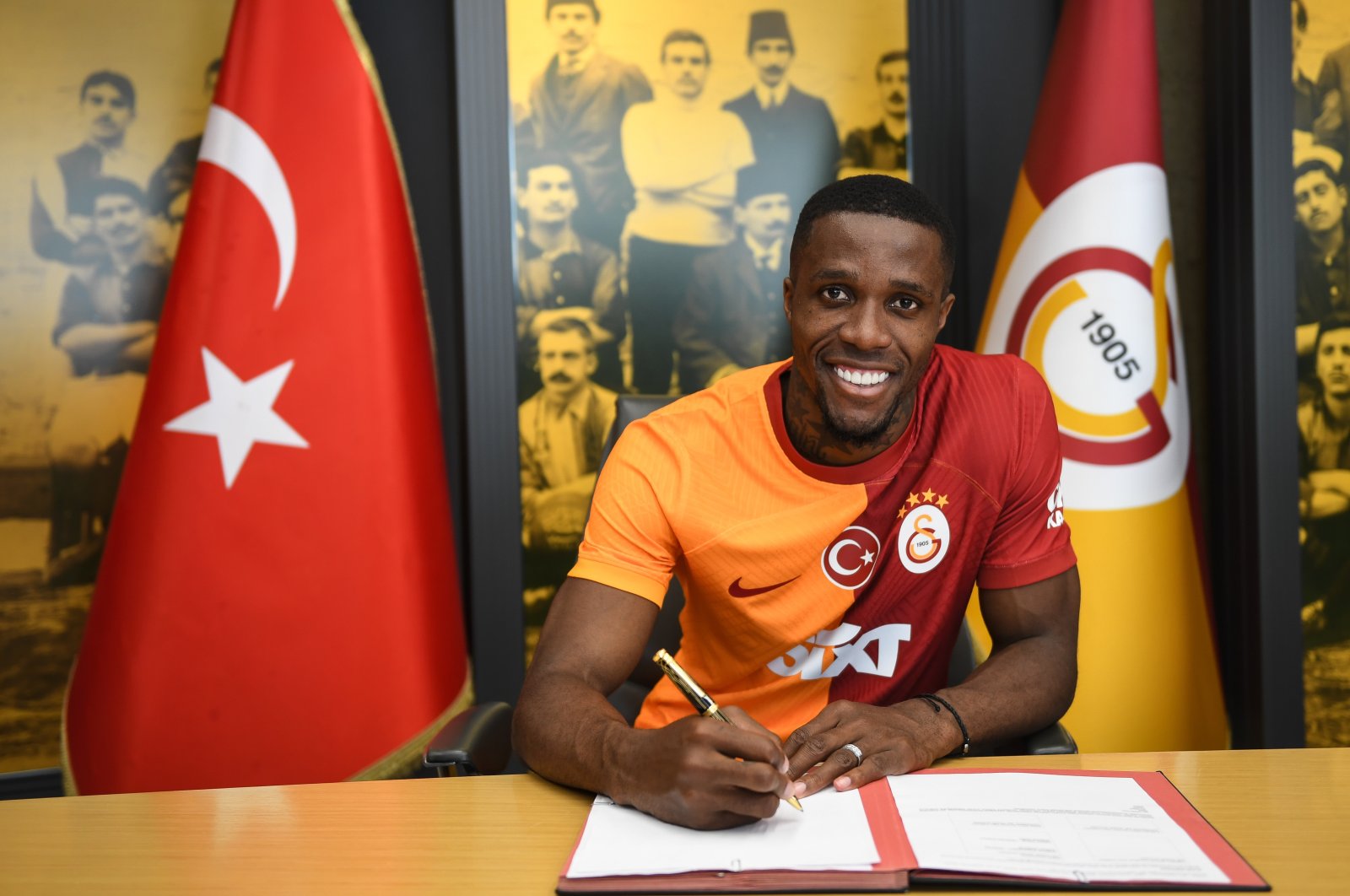 Galatasaray&#039;s new signing Wilfried Zaha signs the contract on his arrival from Crystal Palace, Istanbul, Türkiye, July 24, 2023. (AA Photo)
