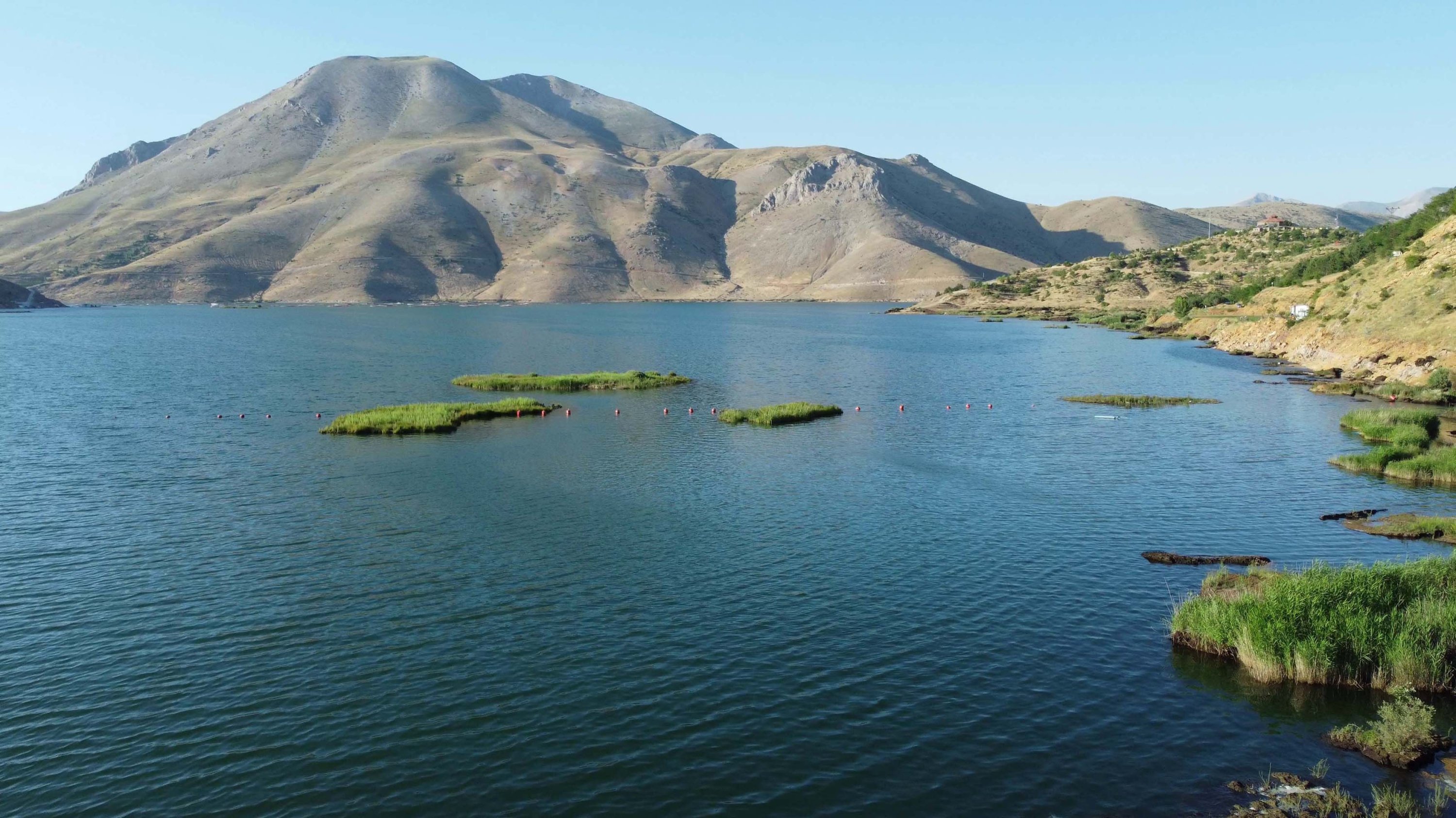 Ancient floating islands are seen in Çat dam lake in Adıyaman, Türkiye, July 26, 2023. (DHA Photo)