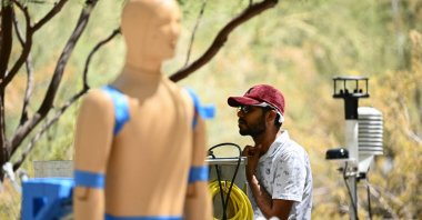 Ankit Joshi monitors a heat and wind experiment with robot ANDI, an Advanced Newton Dynamic Instrument, during a record heat wave in Phoenix, Arizona, U.S., July 20, 2023. (AFP Photo)