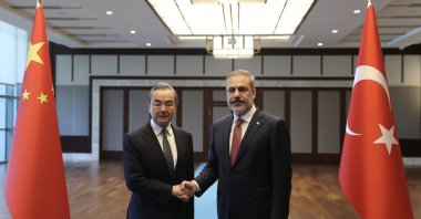 Foreign Minister Hakan Fidan (R) shakes hands with visiting Chinese Foreign Minister Wang Yi, in the capital Ankara, Türkiye, July 26, 2023. (AA Photo)
