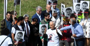 Zübeyir Aydar (third left, in a suit) and Adem Uzun (center, wearing a T-shirt) attend the pro-PKK rally in Brussels, Belgium, July 26, 2023. (AA Photo)