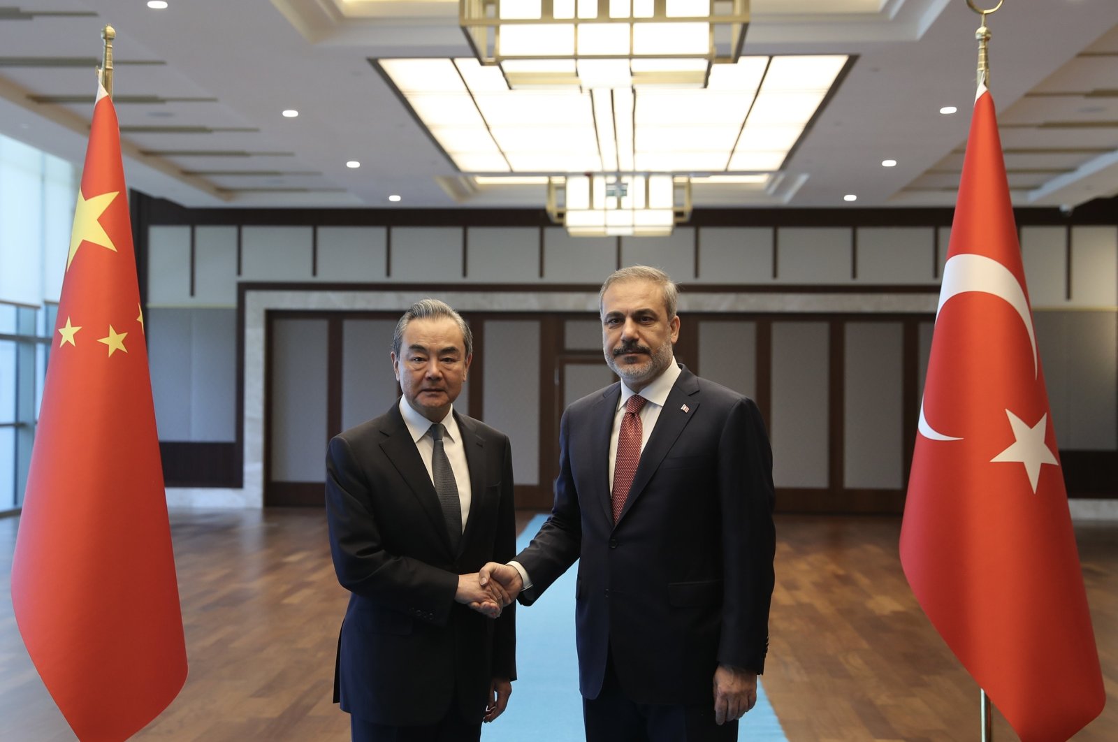 Foreign Minister Hakan Fidan (R) shakes hands with visiting Chinese Foreign Minister Wang Yi, in the capital Ankara, Türkiye, July 26, 2023. (AA Photo)