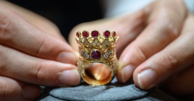 A gold, ruby, and diamond crown ring, designed and worn by the late U.S. rapper Tupac Shakur during his last public appearance in 1996, displayed during a press preview at Sotheby&#039;s in New York, U.S., July 20, 2023. (AFP Photo)
