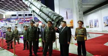 North Korean leader Kim Jong Un and Russia's Defense Minister Sergei Shoigu visit an exhibition of armed equipment on the occasion of the 70th anniversary of the Korean War armistice, North Korea, July 27, 2023. (KCNA Photo) 