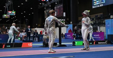 Ukraine's Olha Kharlan (L) gestures as she refuses to shake hands with Russia's Anna Smirnova, registered as an Individual Neutral Athlete (AIN), after she defeated her during the Sabre Women's Senior Individual qualifiers, as part of the FIE Fencing World Championships at the Fair Allianz MI.CO, Milan, Italy, July 27, 2023. (AFP Photo)