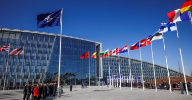 Officials attend a flag-raising ceremony for Finland's accession during NATO foreign ministers' meeting at NATO headquarters in Brussels, Belgium, April 4, 2023. (Reuters Photo)