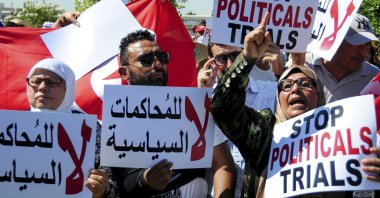 Supporter of Ennahdha party leader Rached Ghannouchi protest in Tunis, Tunisia, July 19, 2022. (AP Photo)
