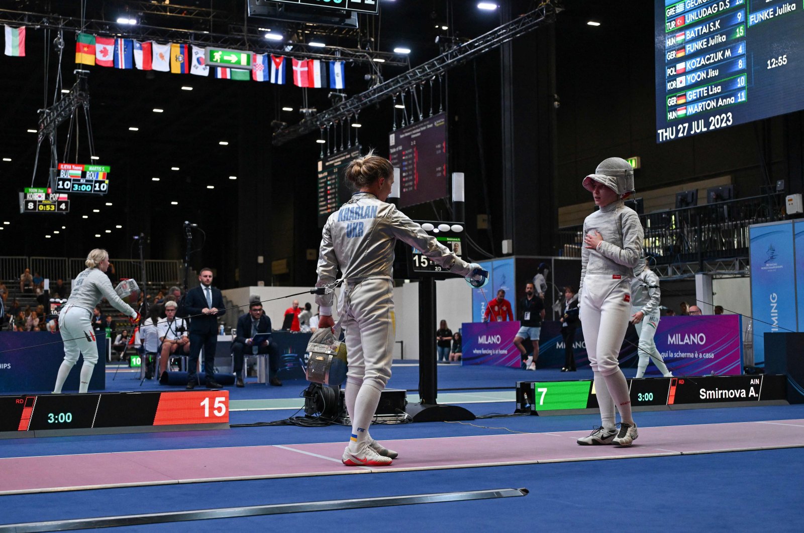 Ukraine&#039;s Olha Kharlan (L) gestures as she refuses to shake hands with Russia&#039;s Anna Smirnova, registered as an Individual Neutral Athlete (AIN), after she defeated her during the Sabre Women&#039;s Senior Individual qualifiers, as part of the FIE Fencing World Championships at the Fair Allianz MI.CO, Milan, Italy, July 27, 2023. (AFP Photo)