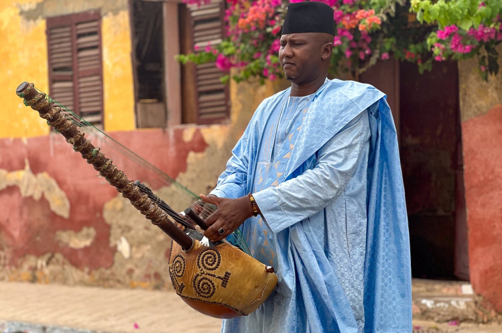 Famous Senegalese maestro Ablaye Cissoko plays the traditional kora instrument, in Saint-Louis, Senegal, July 27, 2023. (AA Photo)
