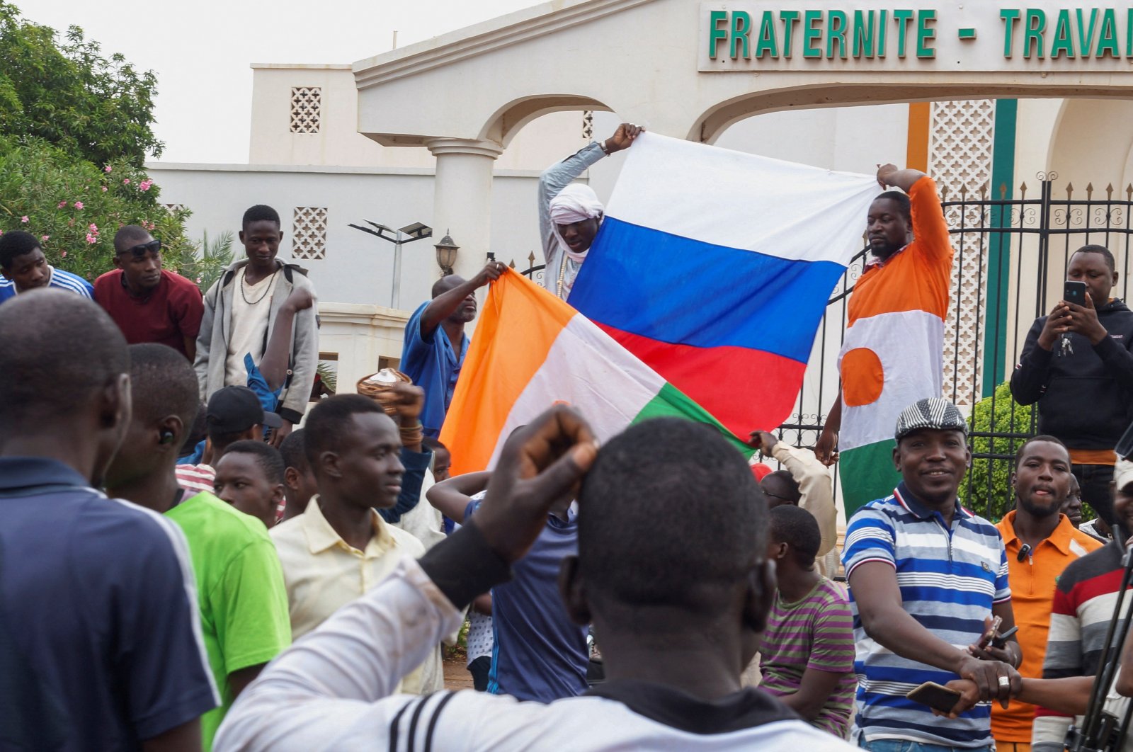 Hundreds of coup supporters gather and hold a Russian flag in front of the National Assembly in Niamey, Niger, July 27, 2023. (Reuters Photo)