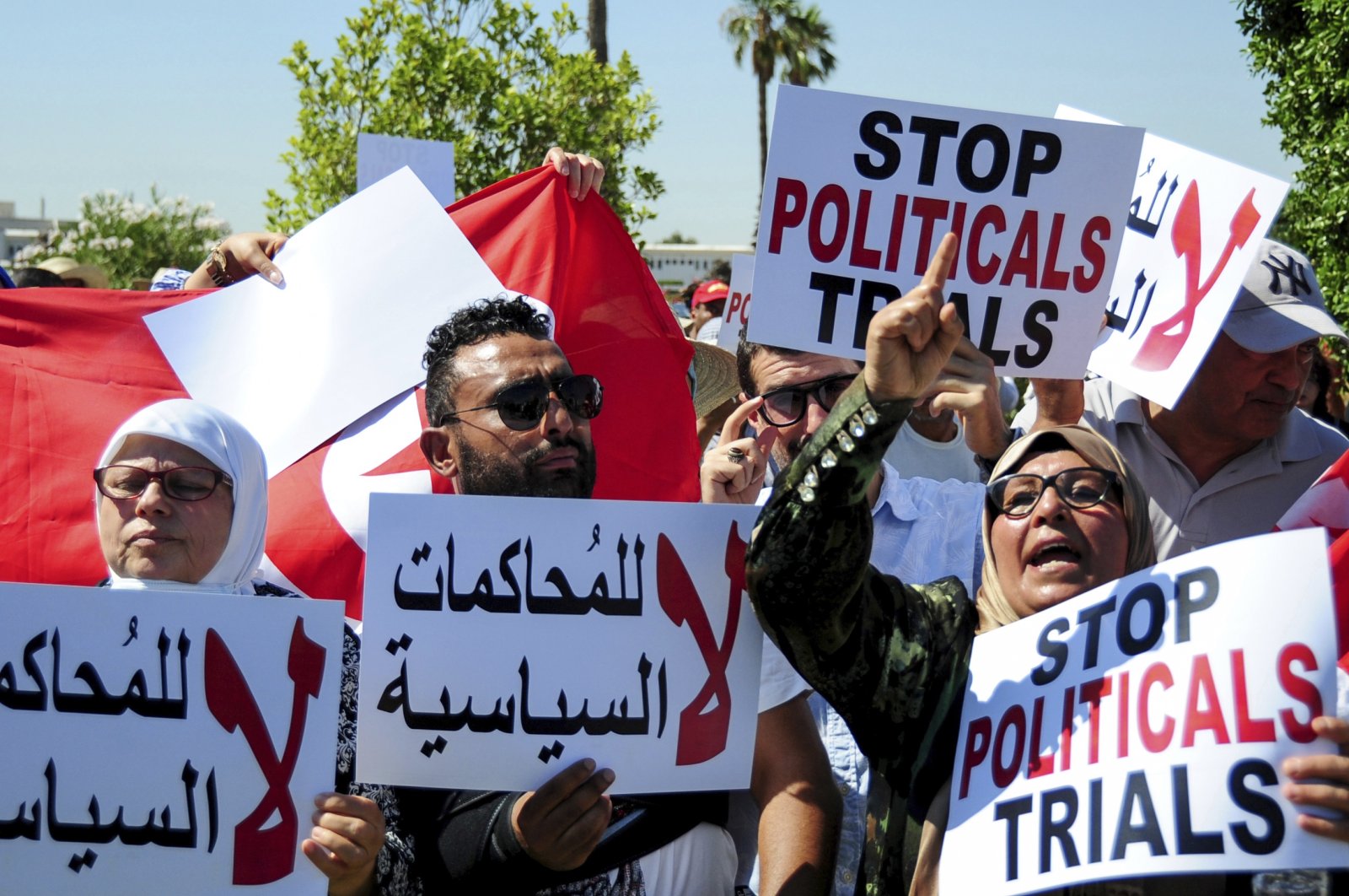 Supporter of Ennahdha party leader Rached Ghannouchi protest in Tunis, Tunisia, July 19, 2022. (AP Photo)