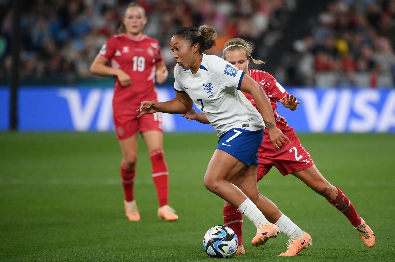 England's Lauren James (C) runs with the ball next to Denmark's Josefine Hasbo (R) during the Women's World Cup match at Sydney Football Stadium, Sydney, Australia, July 28, 2023. (AFP Photo)