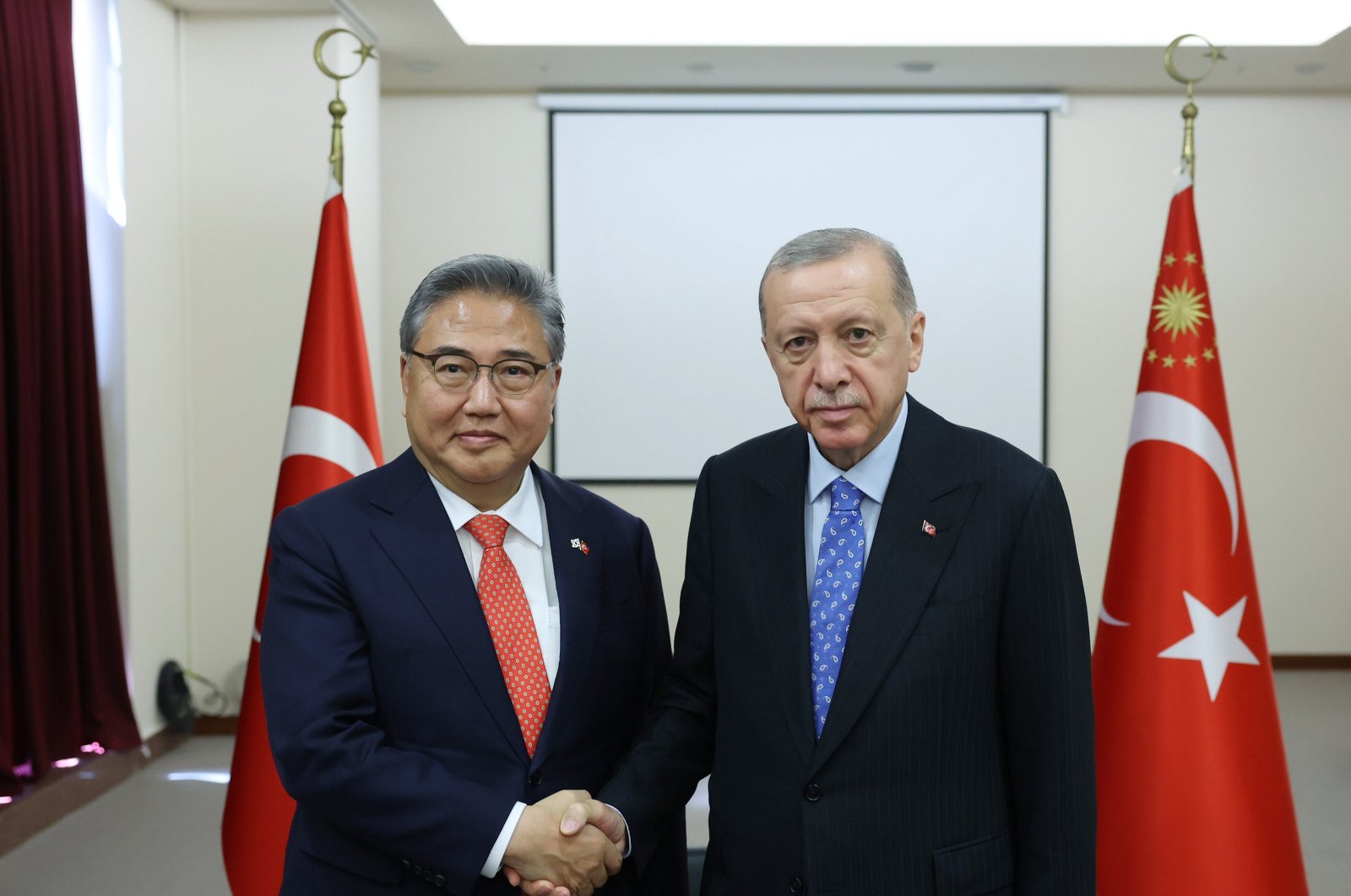 President Recep Tayyip Erdoğan (R) shakes hands with South Korea&#039;s Foreign Minister Park Jin, Istanbul, Türkiye, July 28, 2023. (AA Photo)