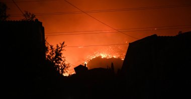 A wildfire burns at the Trapeza village, in Achaia Peloponnese, Greece, July 2023. (EPA Photo)