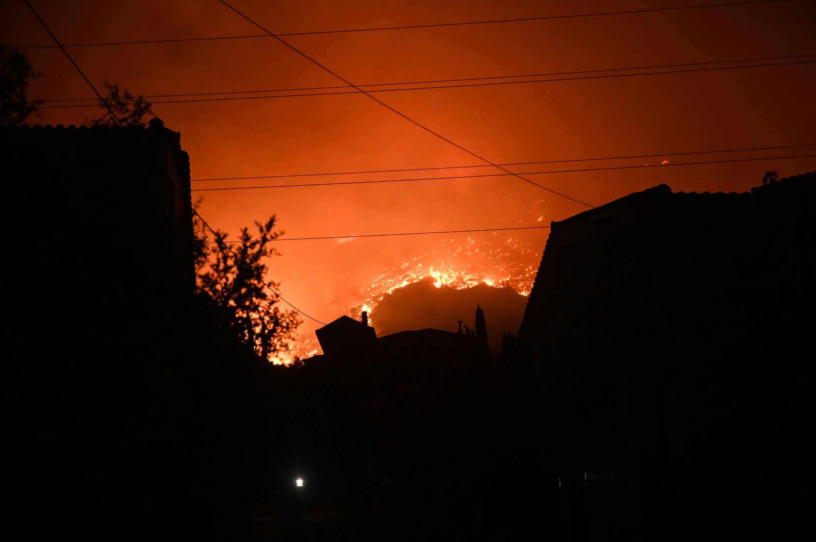 A wildfire burns at the Trapeza village, in Achaia Peloponnese, Greece, July 2023. (EPA Photo)