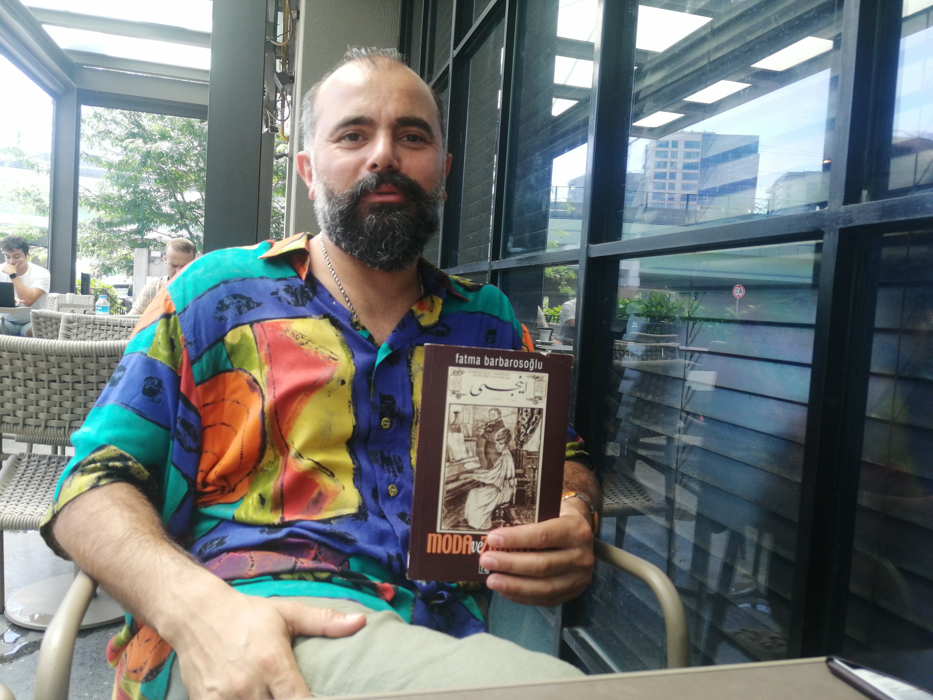 Antiquarian Hamza Demirkapu poses with his most recommended book 