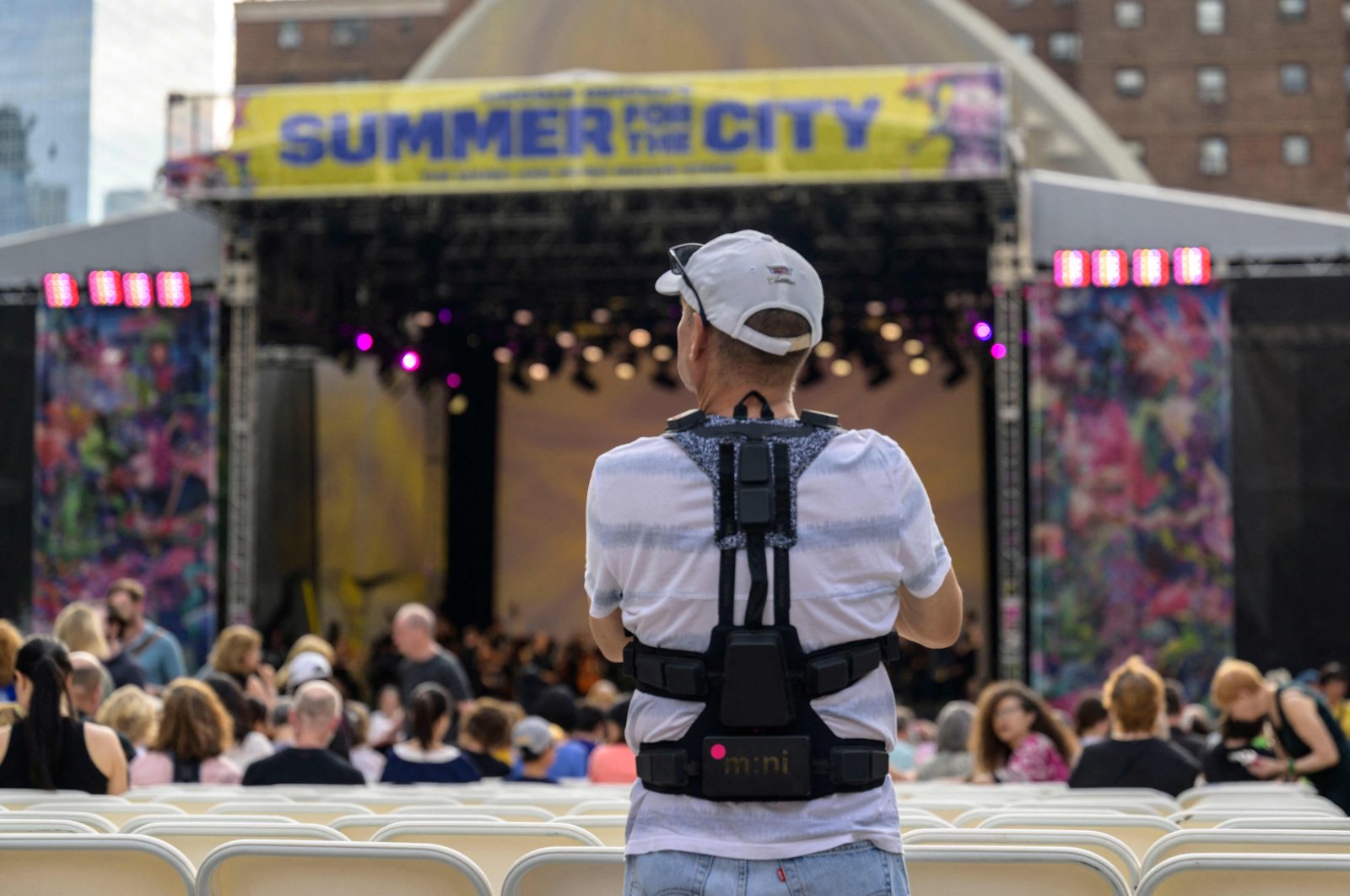 A concertgoer wears haptic suits created for the deaf by Music: Not Impossible, during an outdoor concert at Lincoln Center, New York City, U.S., July 22, 2023. (AFP Photo)