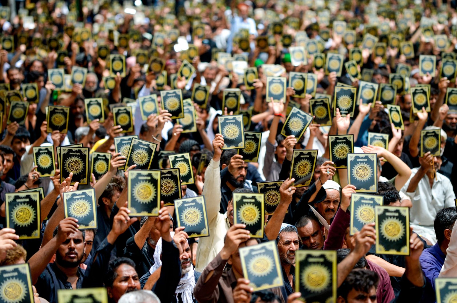 Shiite Muslims make anti-Sweden slogans as they protest against the burning of the Koran outside a Stockholm mosque that outraged Muslims around the world during a procession on the 10th day of Ashura in the Islamic month of Muharram, Karachi, Pakistan, July 29, 2023. (AFP Photo)
