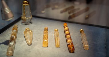 Old perfume bottles are displayed in the exhibition "The Journey of Perfume: The History of Fragrance from Ancient Ages to the Present," Istanbul, Türkiye, July 25, 2023. (Photo by Berrak Sağlam)