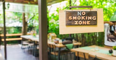 A "No Smoking Zone" sign is hung in an open-door meeting area, July 31, 2023. (Shutterstock Photo)