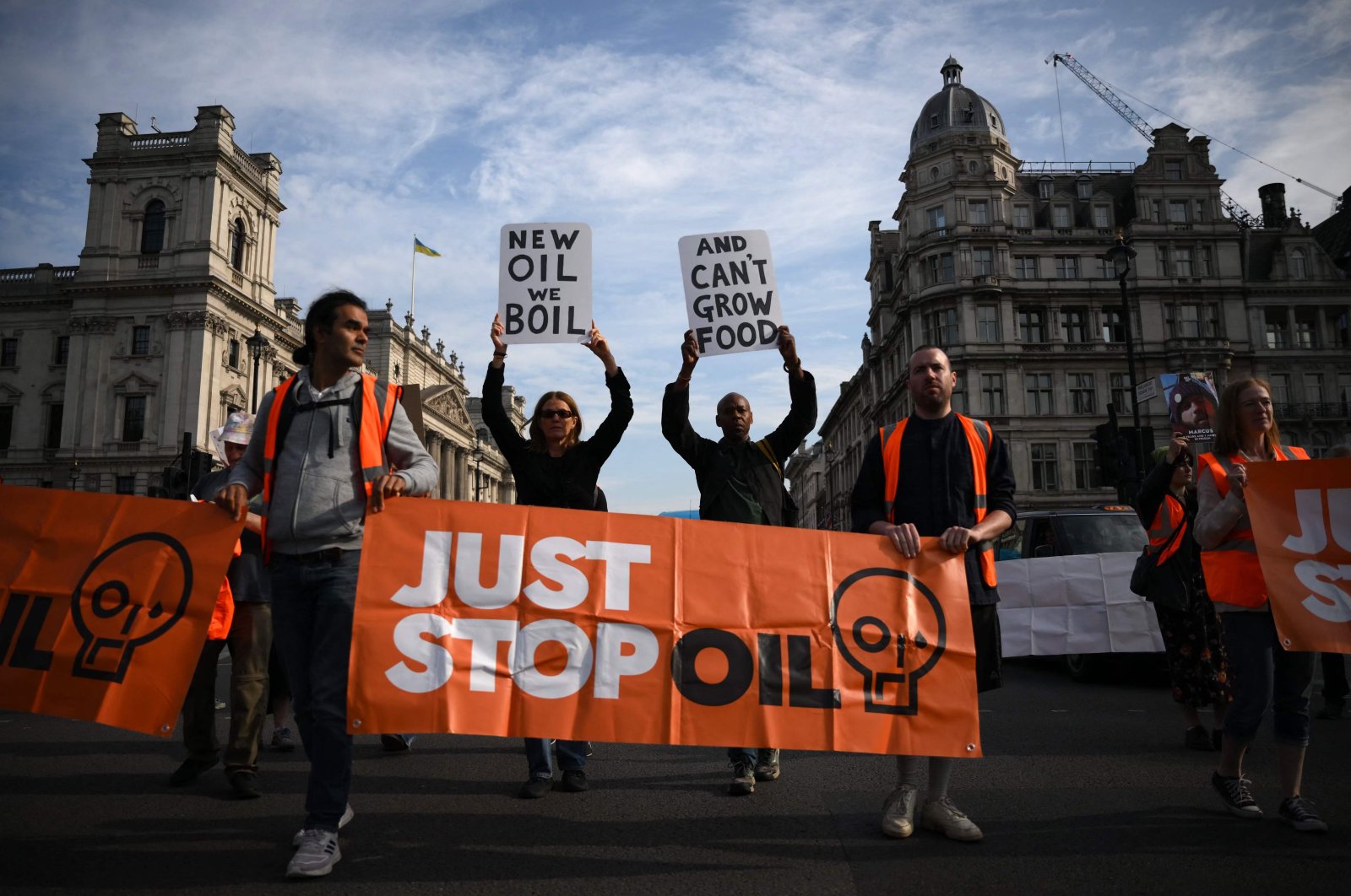 Just Stop Oil climate activists march slowly in Parliament Square in London, Britain, July 21, 2023. (AFP Photo)