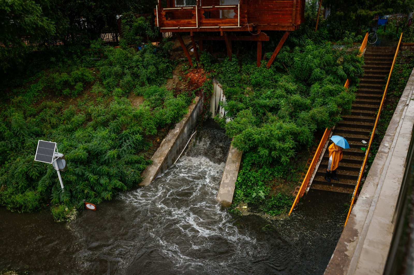 A man fishes as water is released into a river in Beijing, China, July 30, 2023. (EPA Photo)