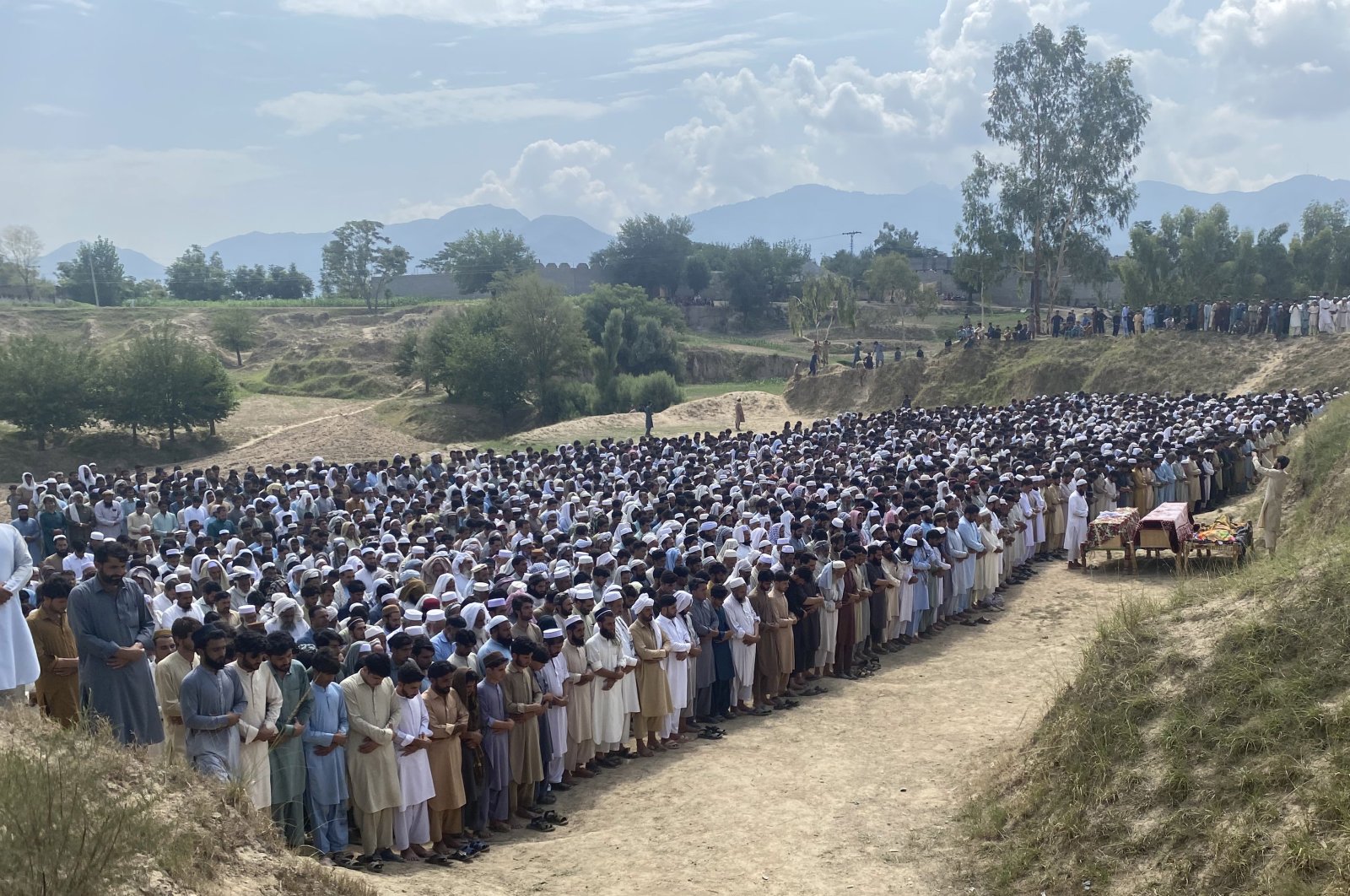 People attend the funeral of the victims of a bomb explosion in Bajaur, Pakistan, July 31, 2023. (EPA Photo)