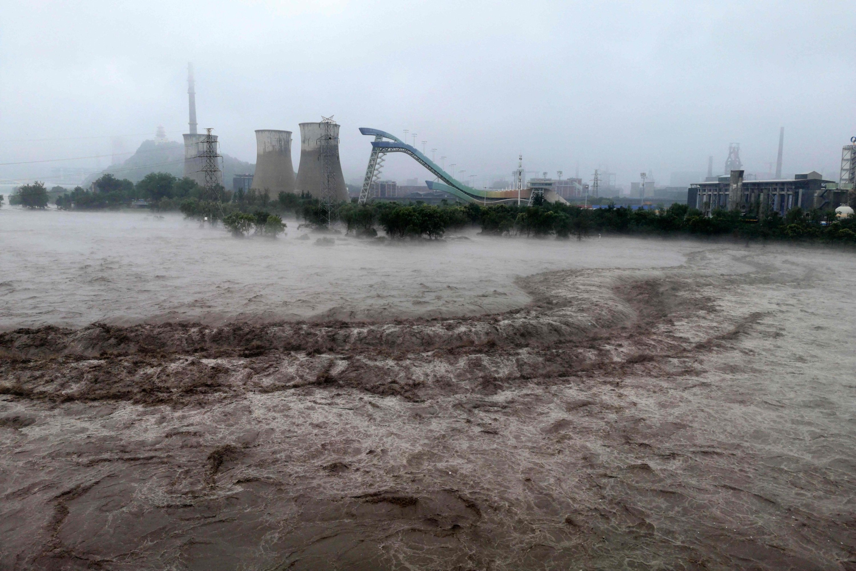 A view of the overflooded Yongding River in Beijing, China, Aug. 1, 2023. (AFP Photo)