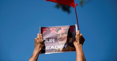 A demonstrator holds up a placard demanding the release of Aung San Suu Kyi, in Yangon, Myanmar, Feb. 11, 2021. (Reuters Photo)