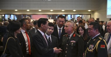 Maj. Gen. Gültekin Yaralı (R) speaks with Liu Shaobin, China's ambassador to Ankara, at a reception in the capital, Türkiye, July 31, 2023 (AA Photo)