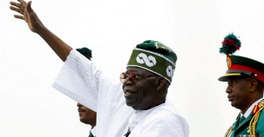 Nigeria's President Bola Tinubu waves to a crowd as he takes the traditional ride on top of a ceremonial vehicle, after his swearing-in ceremony in Abuja, Nigeria, May 29, 2023. (Reuters Photo)