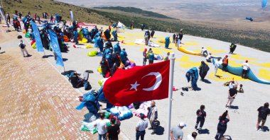 Pilots and medics stand ahead of the commencement of the Paragliding World Cup, Aksaray, Türkiye, July 30, 2023. (AA Photo)