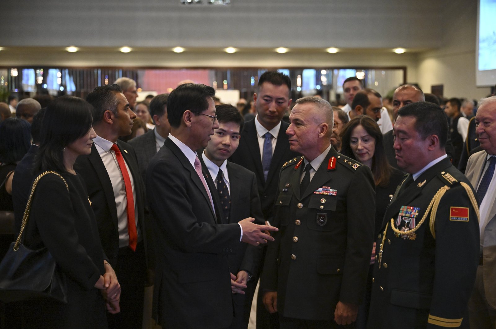 Maj. Gen. Gültekin Yaralı (R) speaks with Liu Shaobin, China&#039;s ambassador to Ankara, at a reception in the capital, Türkiye, July 31, 2023 (AA Photo)
