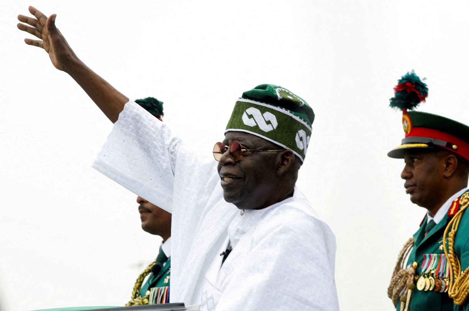 Nigeria&#039;s President Bola Tinubu waves to a crowd as he takes the traditional ride on top of a ceremonial vehicle, after his swearing-in ceremony in Abuja, Nigeria, May 29, 2023. (Reuters Photo)