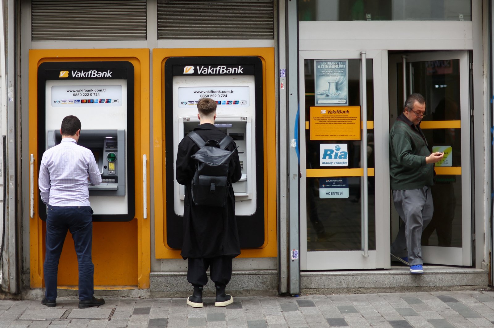 People use ATMs in Istanbul, Türkiye, May 29, 2023. (Reuters Photo)