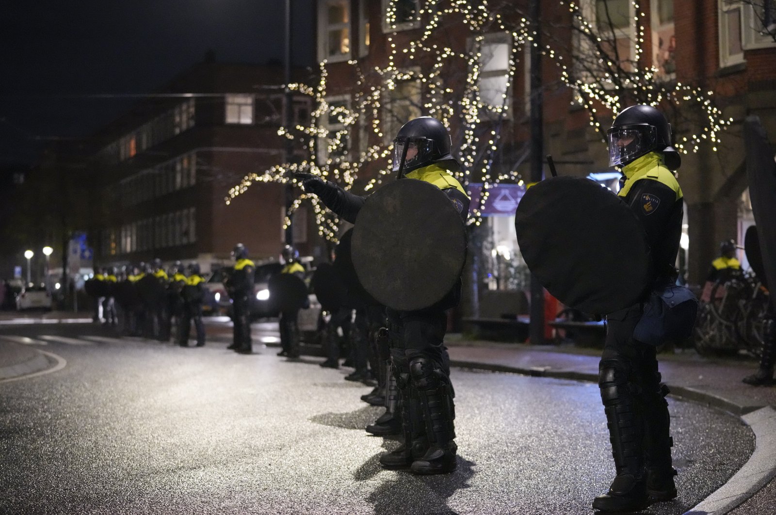 Dutch riot police break up a gathering of Morocco fans after fireworks were thrown when celebrating their team&#039;s victory against Spain in the World Cup round of 16 soccer match between Morocco and Spain, in Amsterdam, Netherlands, Tuesday, Dec. 6, 2022. (AP File Photo)