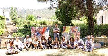The press team poses with Arnica Art Land&#039;s Artistic director and curator, the artist Denizhan Özer, Mersin, Türkiye, July 29, 2023. (Photo courtesy of Arnica Art Land)