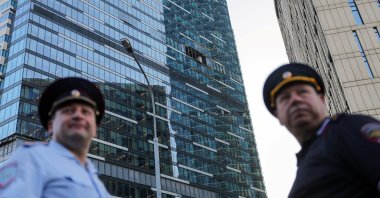 Emergency personnel work near a damaged office building in the Moscow City business district, Moscow, Russia, Aug. 1, 2023. (Reuters Photo)