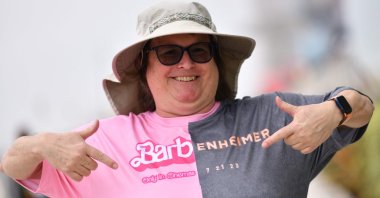 An attendee points at her Barbenheimer shirt outside the convention center during San Diego Comic-Con International in San Diego, California, July 20, 2023. (AFP Photo)