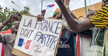 Protesters hold an anti-France placard during a demonstration in Niamey, Niger, Aug. 3, 2023. (AFP Photo)