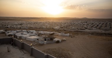 The sun sets over Sharia Camp, where Yazidis displaced by Daesh terrorists are housed near Dohuk, Iraq, Aug. 24, 2019. (AP File Photo)